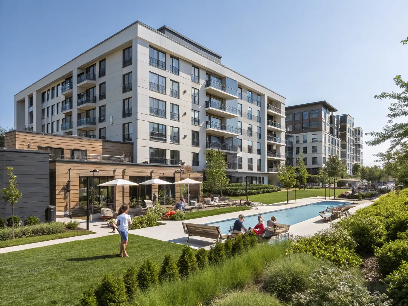 A photograph showcasing the exterior of the apartment building in Can Bruguera, highlighting its modern design and community pool. The image should convey a sense of community and exclusivity.